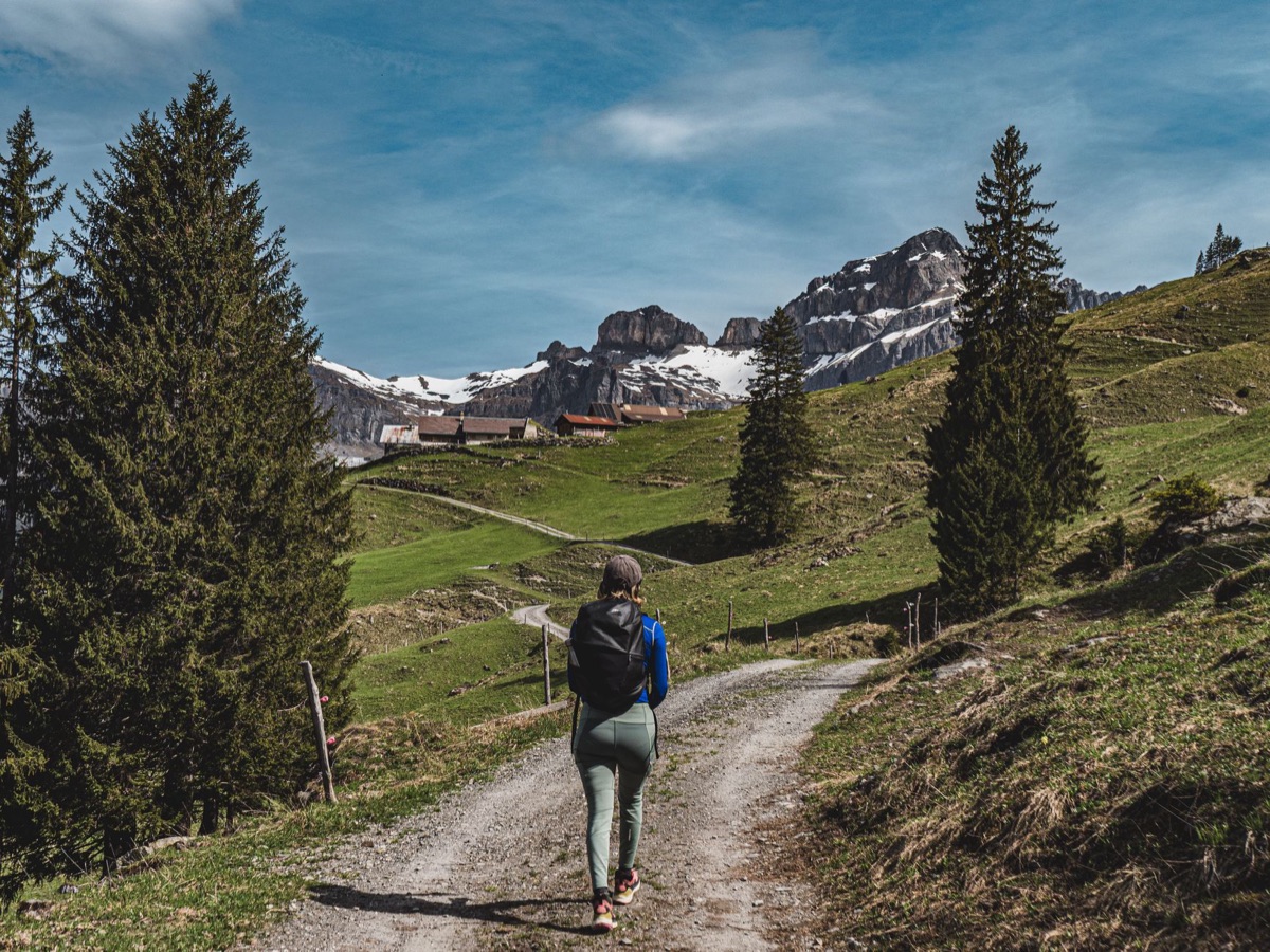 Swiss alpine trail with backpacker hiking