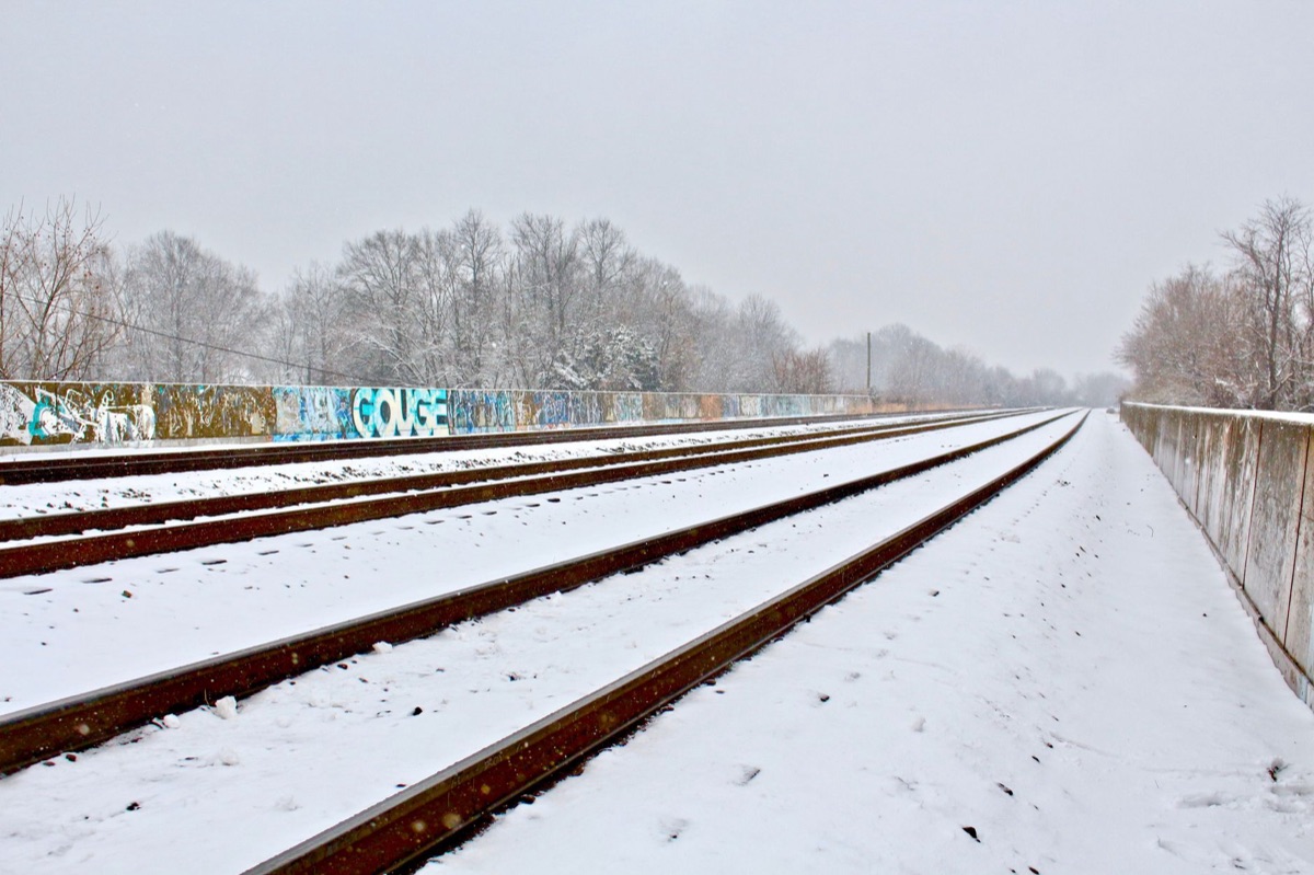 Snow-covered train tracks in the heart of the Alps