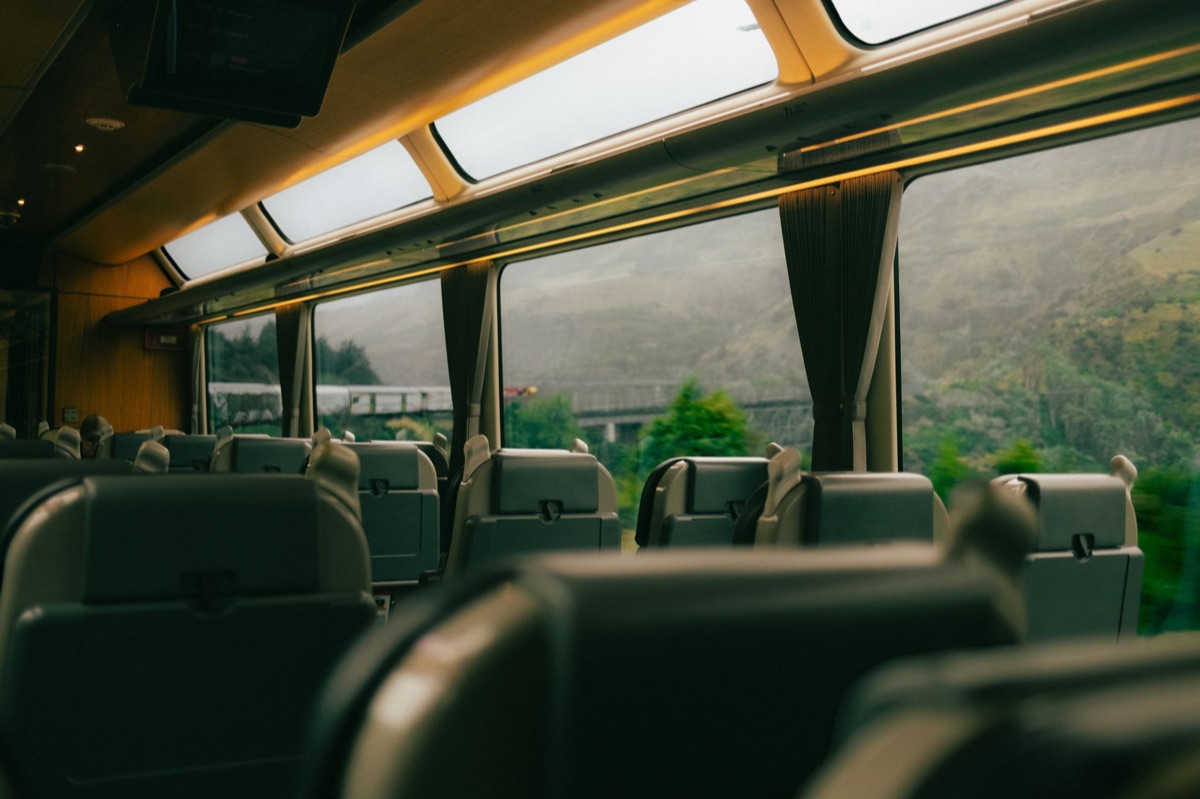 Alpine train window view with snow-covered mountains