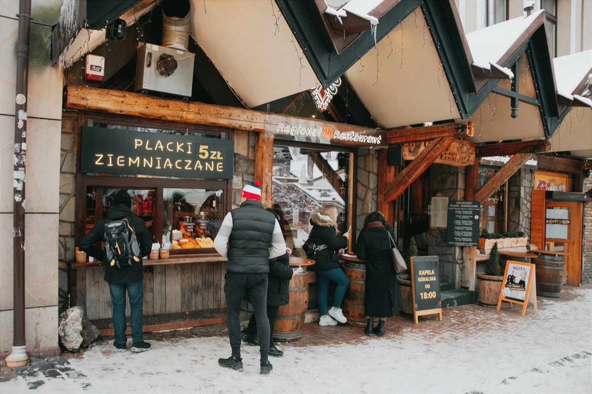 Alpine village market stall with fresh produce and handmade goods
