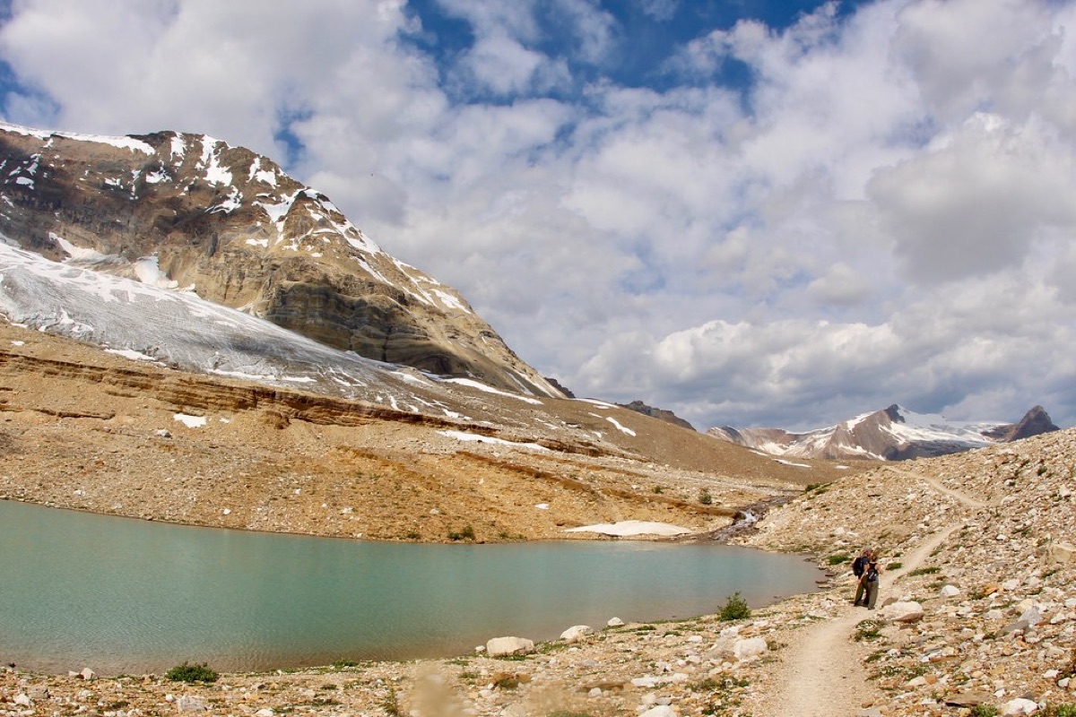 Hiker with backpack on alpine trail