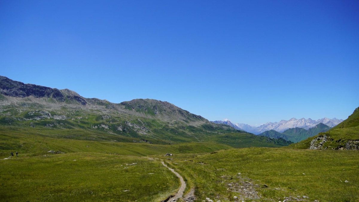 hiker sleeping in alpine hütte with view of mountains