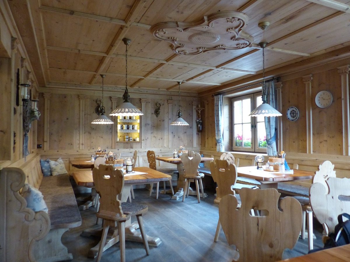 Alpine hütte interior with wooden furniture and stone walls