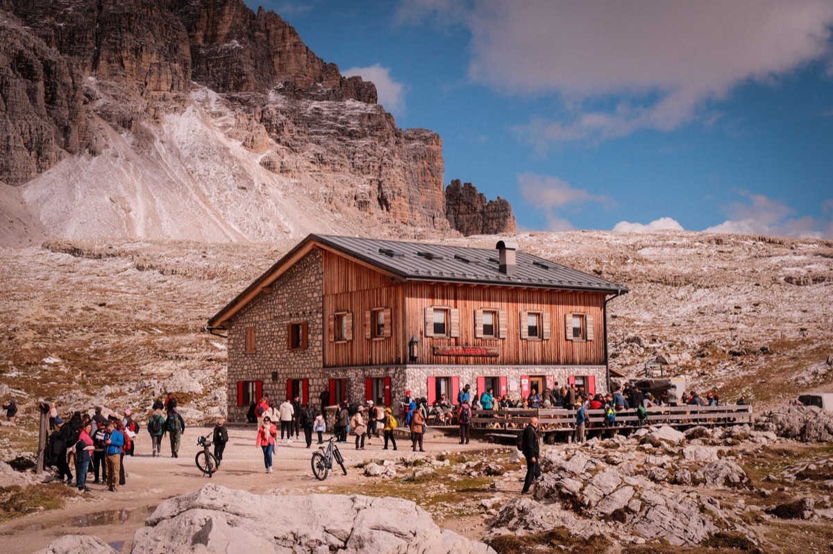 Hiker sleeping in alpine hut