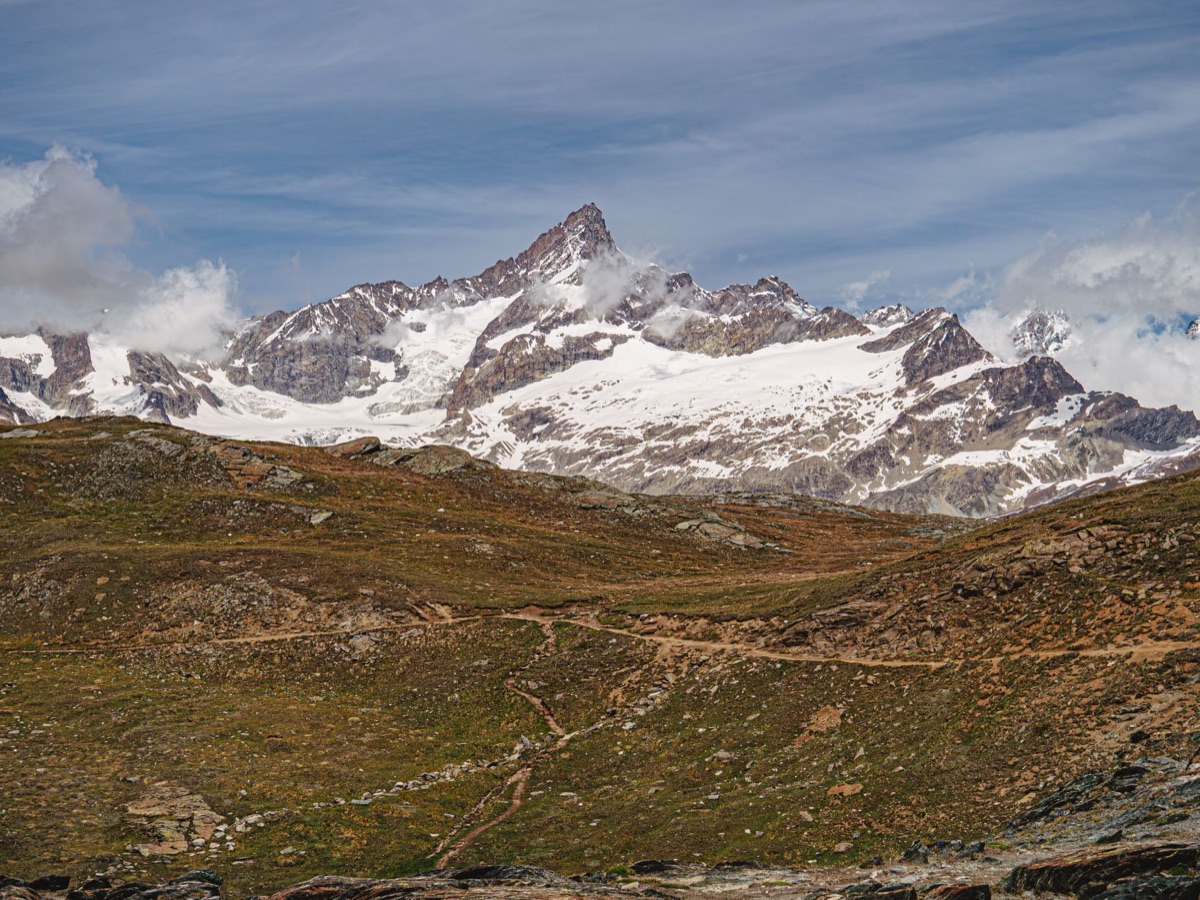 Rocky alpine landscape with snow-capped mountains