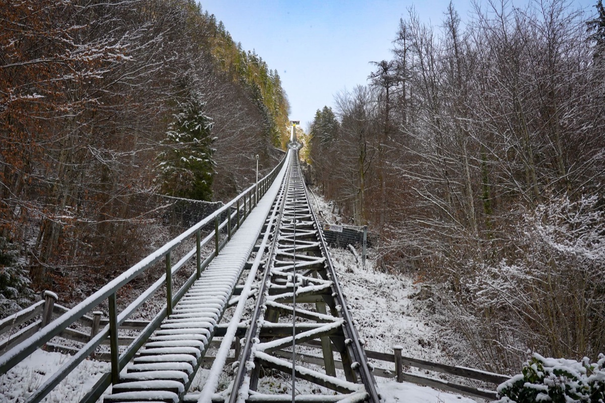 Alpine railway track with snow