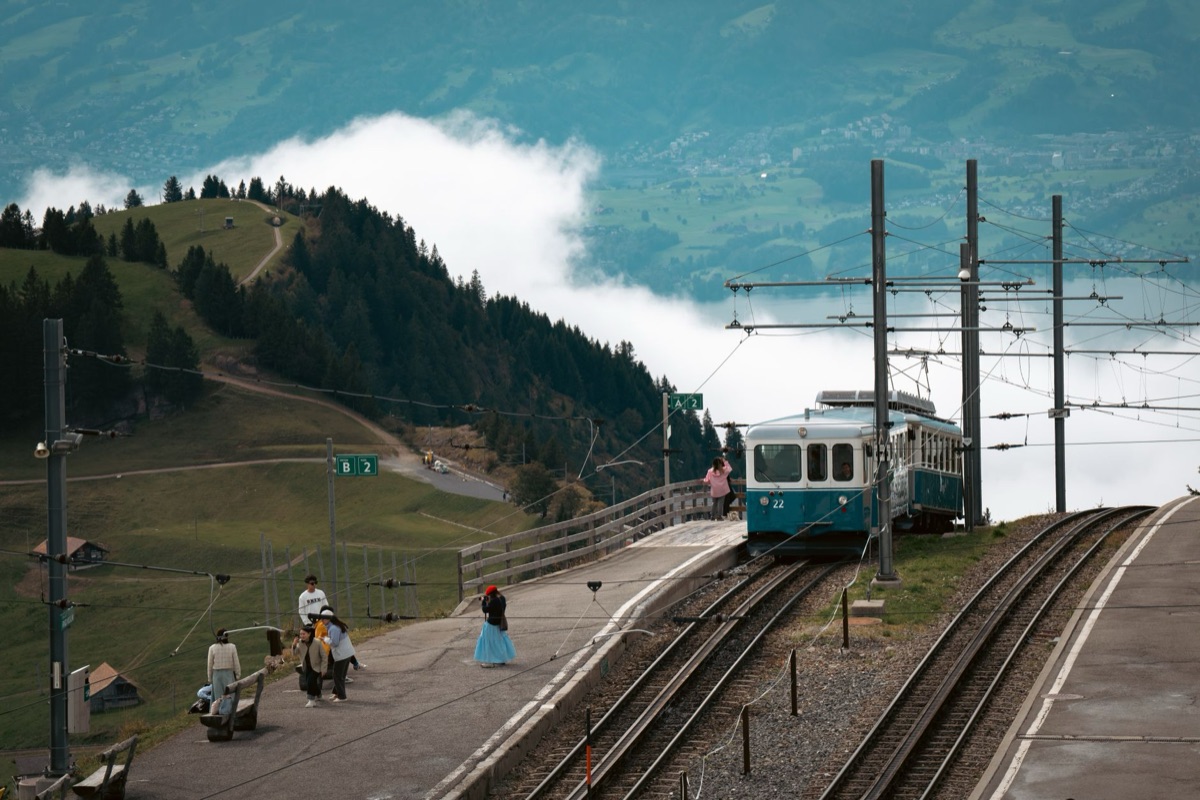 Alpine railway station with locals