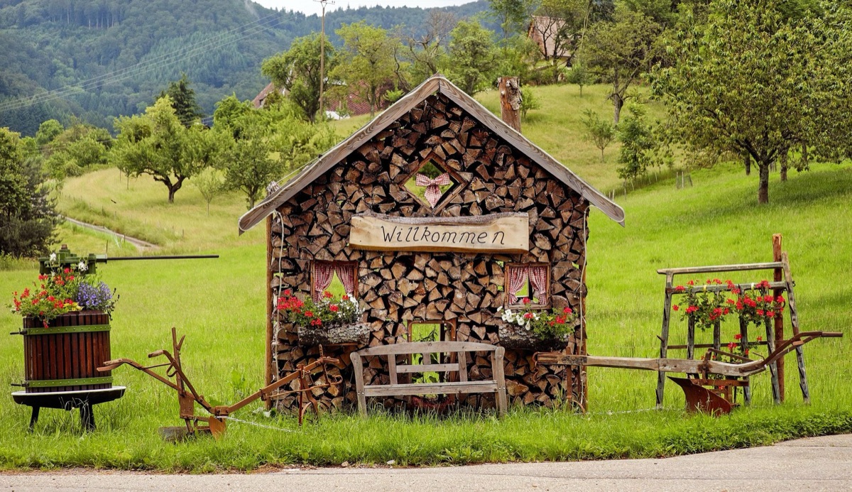 Alpine hut with wooden sign