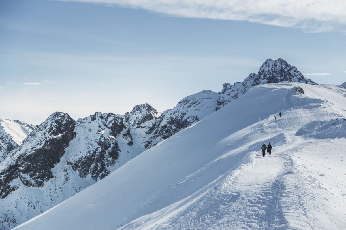 snowy mountain trail with elevation markers